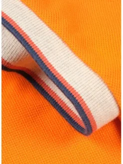Polo orange en coton maille piquée avec nombreux détails coupe droite col boutonné