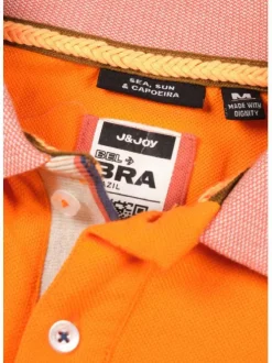 Polo orange en coton maille piquée avec nombreux détails coupe droite col boutonné