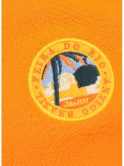 Polo orange en coton maille piquée avec nombreux détails coupe droite col boutonné