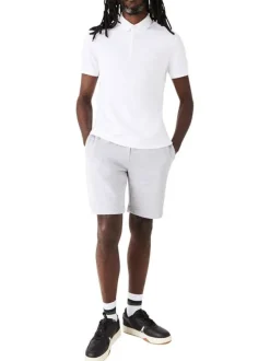 Polo Paris en coton blanc uni coupe droite col boutonné et logo brodé poitrine