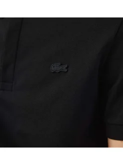 Polo Paris en coton noir uni coupe droite col boutonné et manches resserrées