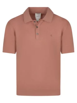Polo rose uni en coton avec une coupe droite et un col à rabats