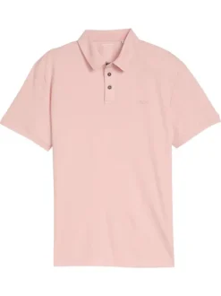 Polo rose uni pourvu de manches courtes et d'un col boutonné