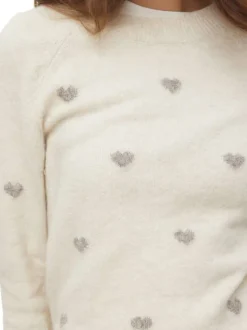Pull beige coupe ajustée pourvu d'un col rond et de manches longues