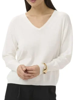 Pull blanc uni pourvu d'une coupe droite et de manches longues