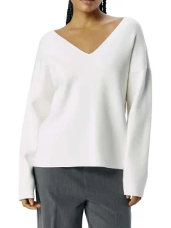 Pull blanc uni pourvu d'une coupe droite et de manches longues