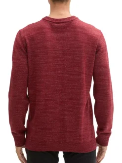 Pull bordeaux uni avec un col rond à coupe droite et un patch d'authenticité