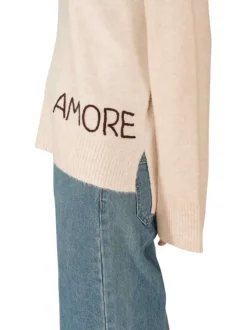 Pull écru en maille fine avec une coupe ample et un col rond