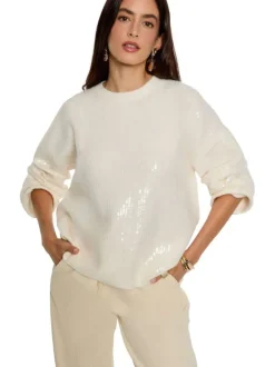 Pull écru parés de sequins brillants et pourvu d'un col rond