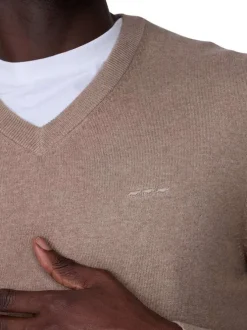 Pull en coton beige uni avec logo iconique et une coupe droite à col v