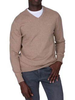 Pull en coton beige uni avec logo iconique et une coupe droite à col v