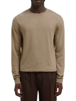 Pull en coton beige uni avec une coupe droite et des manches longues