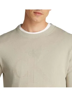 Pull en coton beige uni avec une coupe droite et logo embossé
