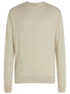 Pull en coton beige uni avec une coupe droite et logo embossé