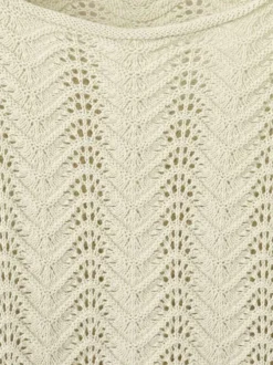 Pull en coton beige uni pourvu d'une coupe évasée et de manches longues