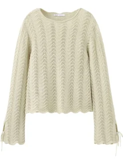 Pull en coton beige uni pourvu d'une coupe évasée et de manches longues