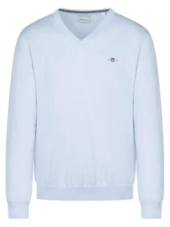 Pull en coton bleu ciel uni avec un col v et le logo brodé à la poitrine