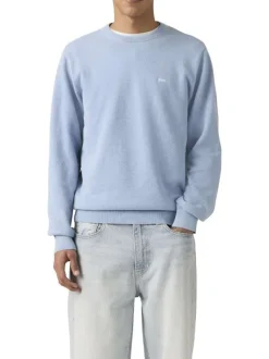 Pull en coton bleu ciel uni avec une coupe droite et un col rond