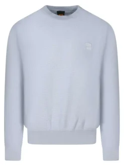 Pull en coton bleu clair uni avec une coupe droite et un col rond