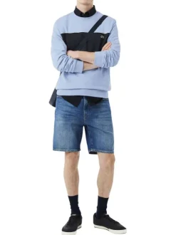 Pull en coton bleu à coupe droite pourvu d'un col rond en maille piquée
