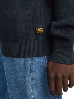 Pull en coton bleu marine en maille côtelée avec un col camionneur