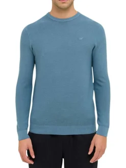 Pull en coton bleu uni avec un col rond et des manches longues