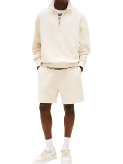 Pull en coton écru uni aspect gaufré avec un col camionneur et le logo brodé