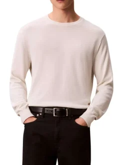 Pull en coton écru uni avec un col rond et des manches longues