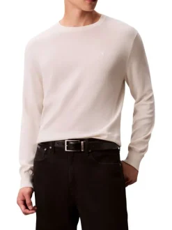 Pull en coton écru uni avec un col rond et des manches longues