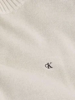 Pull en coton écru uni en maille avec une coupe droite et un col rond