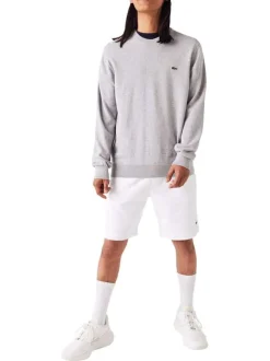 Pull en coton gris uni coupe droite avec un col rond et logo poitrine