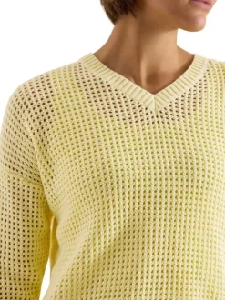 Pull en coton jaune uni pourvu d'un cordon de serrage et de manches longues