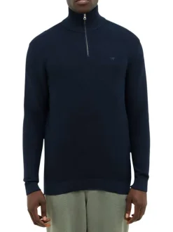 Pull en coton marine avec un col camionneur à zip et des manches longues