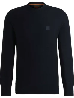 Pull en coton marine pourvu d'un col rond et de manches longues
