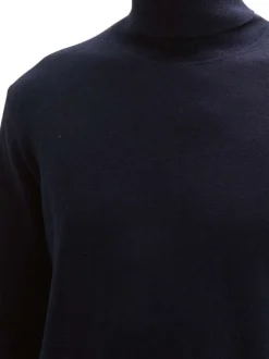 Pull en coton marine uni avec une coupe droite et col roulé en côtes
