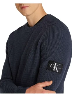 Pull en coton marine uni avec une coupe droite et logo de la marque