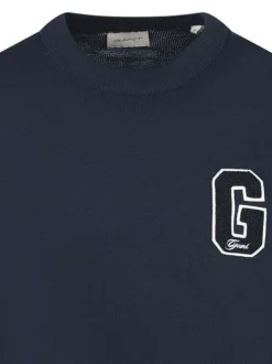 Pull en coton marine uni à coupe ajustée avec un logo brodé sur la poitrine