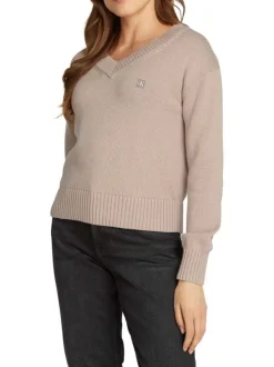 Pull en coton mauve uni avec logo iconique et une coupe droite à col v