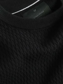 Pull en coton noir à coupe droite en maille avec un col rond
