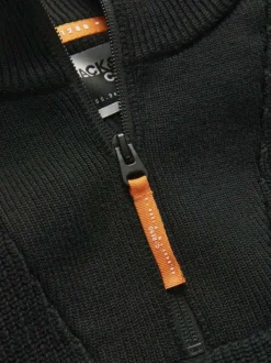 Pull en coton noir côtelé à coupe droite et col montant et zippé resserré