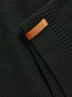 Pull en coton noir côtelé à coupe droite et col montant et zippé resserré