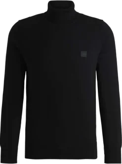Pull en coton noir pourvu d'un col roulé et de manches longues
