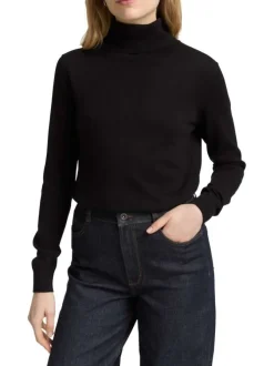 Pull en coton noir uni avec un col roulé et des manches longues