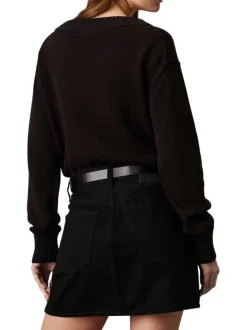 Pull en coton noir uni avec une coupe droite à col v et logo iconique