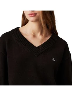 Pull en coton noir uni avec une coupe droite à col v et logo iconique