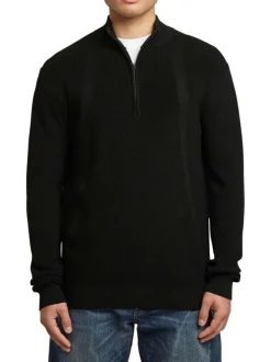 Pull en coton noir uni avec une coupe droite et un col camionneur