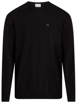 Pull en coton noir uni avec une coupe droite un col rond et le logo en petit