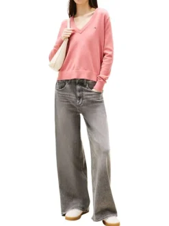 Pull en coton rose uni avec une coupe crop et un col en V profond