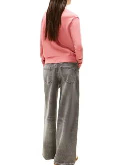 Pull en coton rose uni avec une coupe droite et un col v