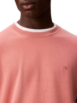 Pull en coton rose uni à col rond avec le mini logo brodé à la poitrine